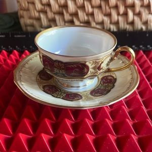 ANTIQUE FÜRSTENBERG MAROON AND GOLD DEMITASSE TEACUP AND SAUCER